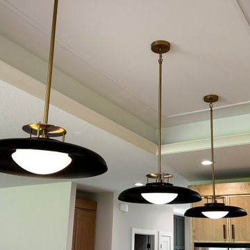 Maple Pecan Stain and Painted Black Kitchen Design in Bettendorf, Iowa
