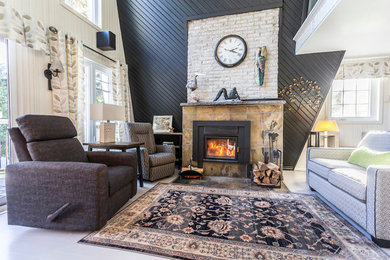 Example of a small transitional formal and loft-style painted wood floor and beige floor living room design in Montreal with black walls, a standard fireplace, a stone fireplace and no tv