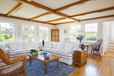 Mid-sized beach style formal and open concept medium tone wood floor and brown floor living room photo in Boston with white walls, no fireplace and no tv