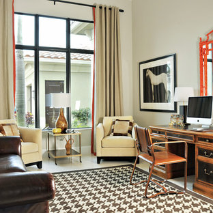 Design ideas for a mid-sized transitional study room in Miami with beige walls, a freestanding desk, marble floors and no fireplace.