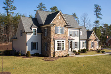 Example of a french country exterior home design in Richmond