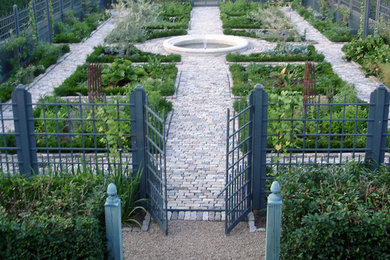 Photo of a large farmhouse backyard stone landscaping in New York.