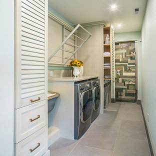 Medium sized classic single-wall separated utility room in Seattle with an utility sink, louvered cabinets, engineered stone countertops, green walls and a side by side washer and dryer.