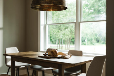 Example of a transitional dining room design in Other