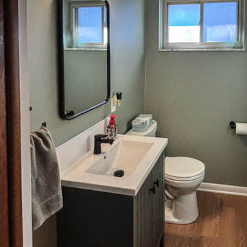 Powder Room with Linear Vintage Green Vanity with White Ceramic Countertop