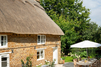Photo of a full sun garden in Other with natural stone paving.