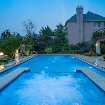 Burr Ridge Lap Pool with Raised Hot Tub and Waterfall