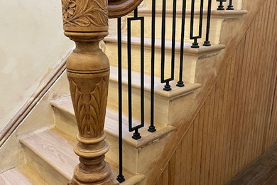 Example of a small classic wooden straight mixed material railing staircase design in New York with wooden risers