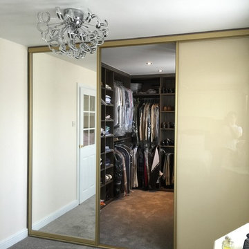 Grey-Beige Zebrano Walk-in wardrobe with Gold sliding doors