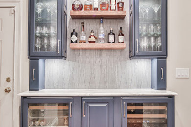 Example of a transitional home bar design in Atlanta