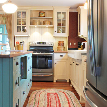 Cream Farmhouse Kitchen with Green Island & Paneled Dishwasher