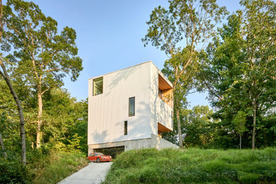 Inspiration for a large modern white three-story house exterior remodel