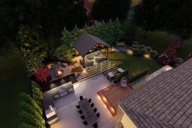 Mid-sized elegant backyard concrete patio kitchen photo in Toronto with a gazebo