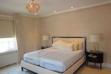 Mid-sized traditional master bedroom in New York with beige walls, carpet, no fireplace and beige floor.