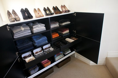 Example of a small trendy women's carpeted dressing room design in Los Angeles with white cabinets