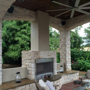Houston outdoor sitting area with cool arches, warm fireplace