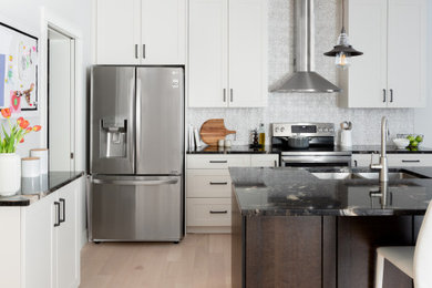 Example of a transitional kitchen design in Calgary