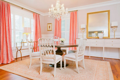 Example of a mid-sized classic medium tone wood floor enclosed dining room design in DC Metro with no fireplace and beige walls