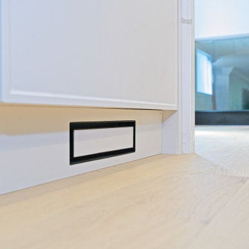 Integrated Toe-Kick Vent Beneath White Kitchen Cabinetry | North York