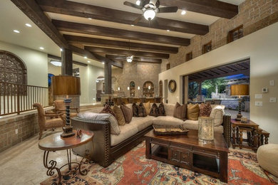 Huge tuscan formal and open concept travertine floor living room photo in Phoenix with beige walls, a corner fireplace, a concrete fireplace and a media wall