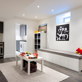 Contemporary look-out basement in Toronto with white walls and no fireplace.