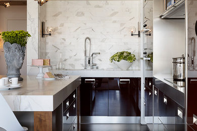Photo of a contemporary kitchen in San Francisco with flat-panel cabinets, white splashback and dark hardwood floors.