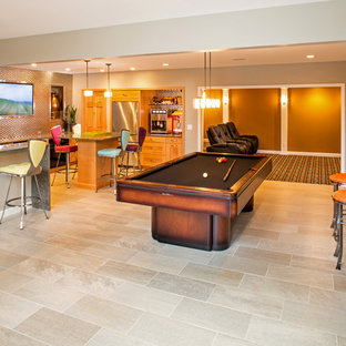 Design ideas for an expansive bohemian walk-out basement in St Louis with ceramic flooring and orange walls.