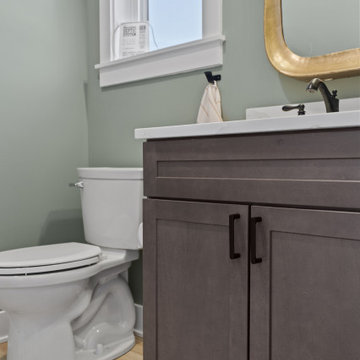 Warm and Cohesive Multi-Bathroom Design In Nokesville