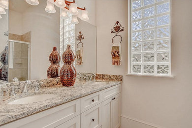 Inspiration for a contemporary master beige tile and porcelain tile porcelain tile bathroom remodel in Miami with shaker cabinets, beige cabinets, beige walls, an undermount sink and granite countertops