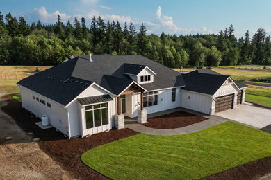Example of a country exterior home design in Portland