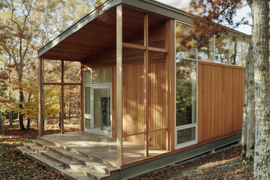 This is an example of a modern exterior in New York with wood siding.