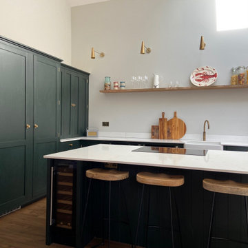 Large handmade kitchen with kitchen island and full length larder