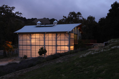 Example of a cottage exterior home design in Other