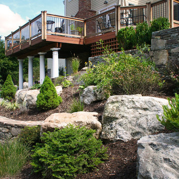 Stone retaining wall with landscape