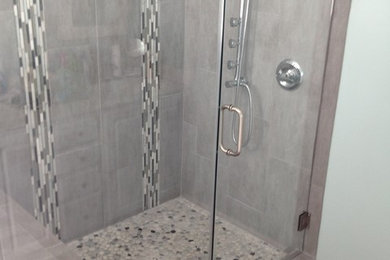 Bathroom - mid-sized transitional master porcelain tile ceramic tile bathroom idea in Raleigh with shaker cabinets, dark wood cabinets, a one-piece toilet, a vessel sink, granite countertops and blue walls