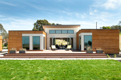 Design ideas for a mid-sized contemporary one-storey brown exterior in San Francisco with wood siding and a flat roof.
