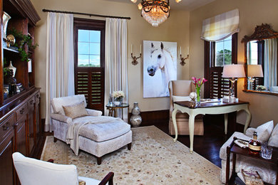 Mid-sized elegant freestanding desk dark wood floor study room photo in Detroit with beige walls