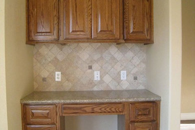 Inspiration for a timeless medium tone wood floor and brown floor eat-in kitchen remodel in Other with raised-panel cabinets, medium tone wood cabinets, granite countertops, beige backsplash and stone tile backsplash