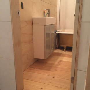 Inspiration for a small scandinavian plywood floor claw-foot bathtub remodel in Toronto