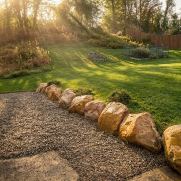 Boulder Retaining Wall Gravel Patio