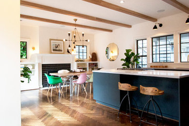 Inspiration for a large transitional dark wood floor kitchen/dining room combo remodel in Portland with white walls and a standard fireplace