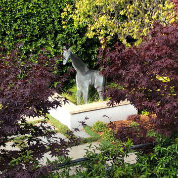 giraffe sculpture in garden