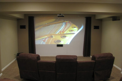 Inspiration for a modern home theater remodel in Omaha