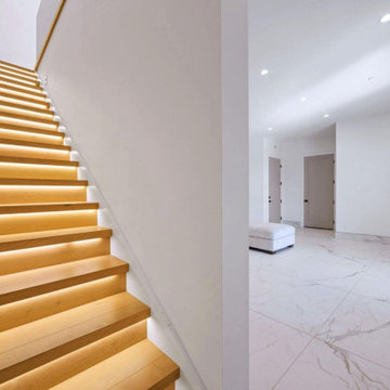 Illuminated Floating Wood Staircase with Integrated Step Lighting
