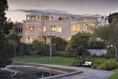 Inspiration for a large modern three-story stucco exterior home remodel in San Francisco