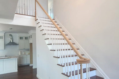 Inspiration for a mid-sized timeless wooden straight wood railing staircase remodel in New York with wooden risers