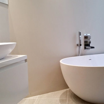 Matching limestone egg shaped basin and bath in Coleherne Court, South Kensingto