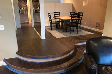 Inspiration for a mid-sized transitional brown floor kitchen/dining room combo remodel in Seattle with brown walls and no fireplace