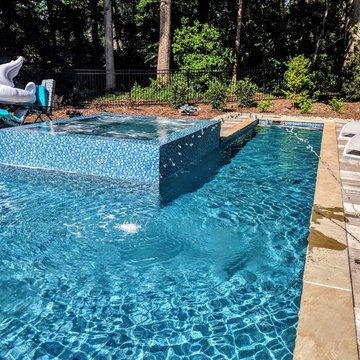 Gorgeous Glass Tile 360 Spillover Spa and lap pool