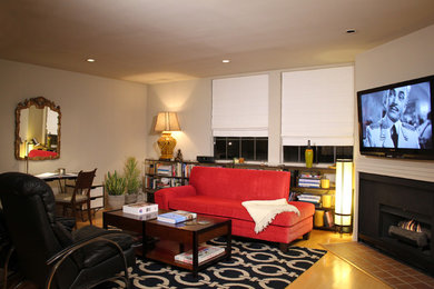 Example of a large eclectic enclosed light wood floor living room design in Los Angeles with beige walls, a corner fireplace, a metal fireplace and a media wall